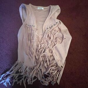 Woman’s pink fringe faux suede vest